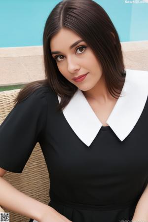 A woman in a red bra and blue jacket posing for a picture.