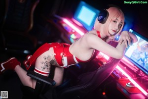A woman in a red and white outfit with headphones on.