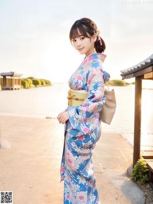 A woman in a kimono posing for the camera.