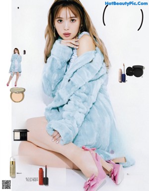 A magazine with a picture of a woman in a white dress.