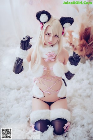 A woman in a cat costume posing for a picture.