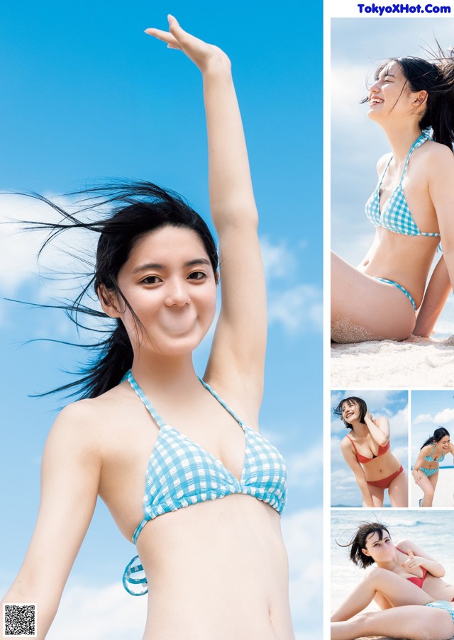 A woman in a blue and white bikini on the beach.