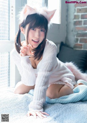 A woman in a white lingerie posing for a magazine.